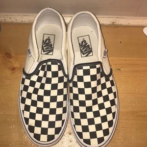 Black and white slip on checkered vans